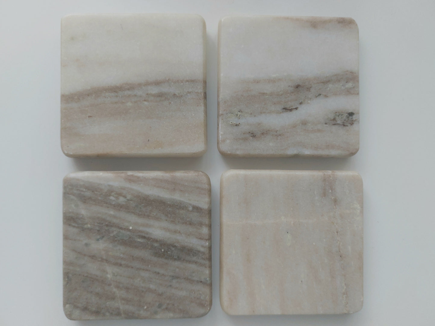 Smooth, matte, natural marble coasters, mix of beige, cream to brown colour