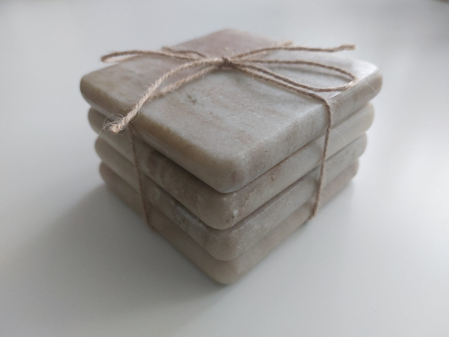 Smooth, matte, natural marble coasters, mix of beige, cream to brown colour