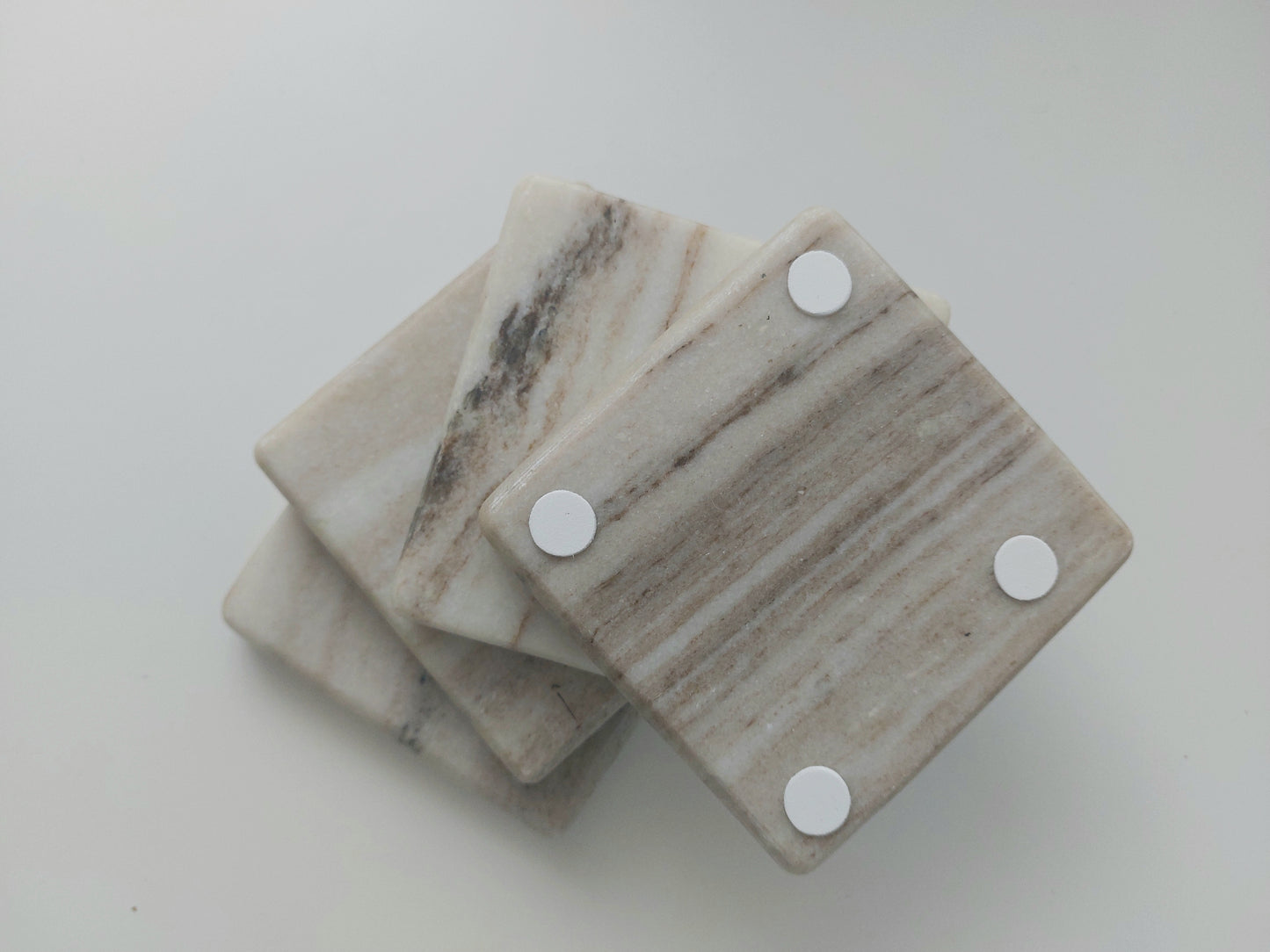 Smooth, matte, natural marble coasters, mix of beige, cream to brown colour