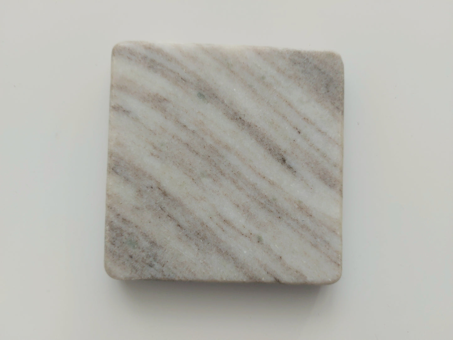 Smooth, matte, natural marble coasters, mix of beige, cream to brown colour