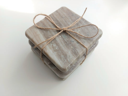Smooth, matte, natural marble coasters, mix of beige, cream to brown colour