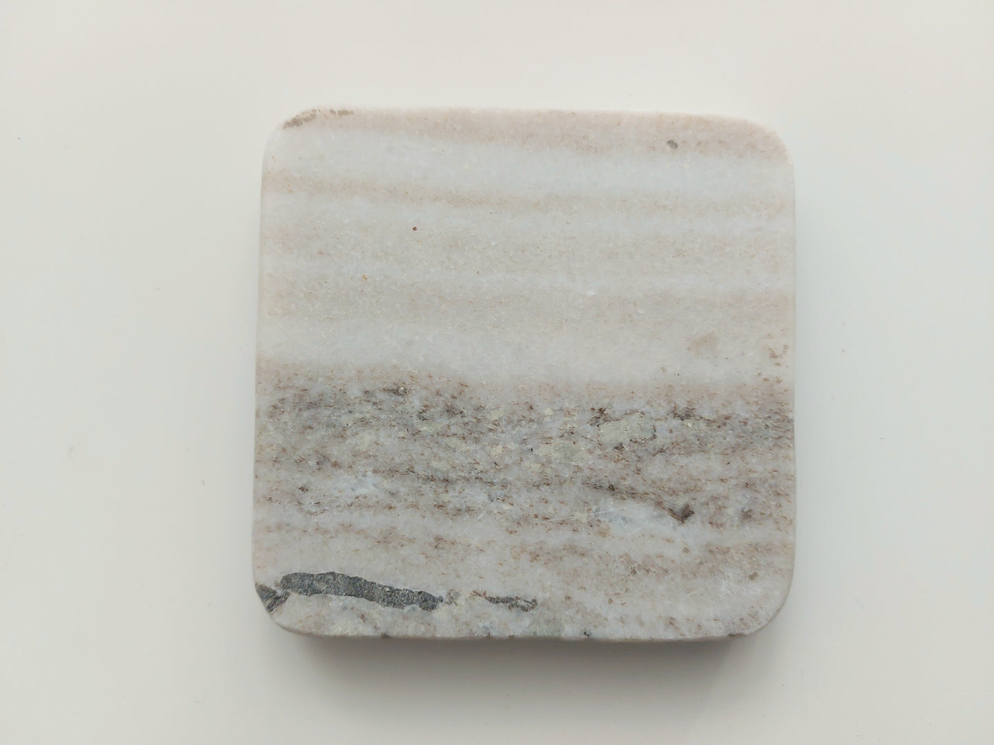 Smooth, matte, natural marble coasters, mix of beige, cream to brown colour