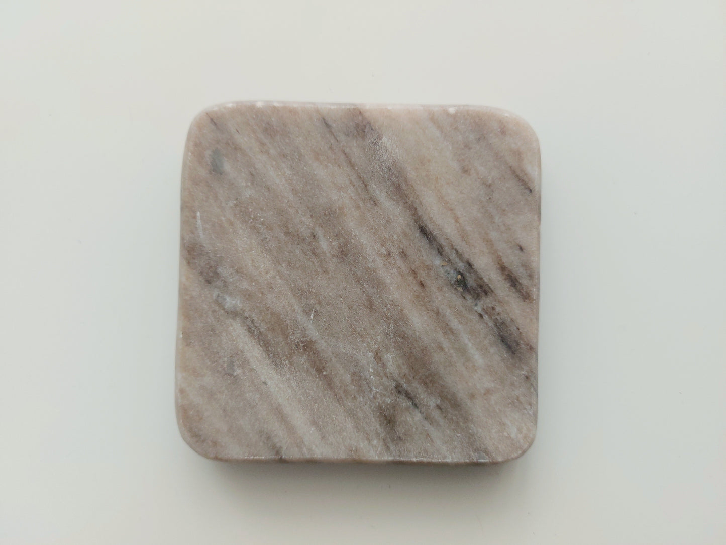 Smooth, matte, natural marble coasters, mix of beige, cream to brown colour